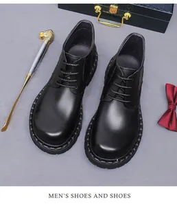 Detailed view of polished black leather dress boots with non-slip thick outsoles