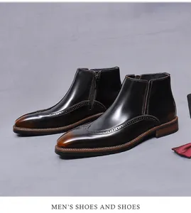 Detailansicht der Chelsea-Boots aus Leder mit Brogue-Mustern und edler roter Fliege