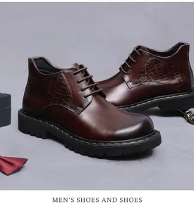 Detail view of brown leather boots featuring crocodile pattern and thick non-slip soles
