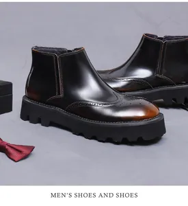 Detalle de botas Chelsea de hombre con tallado brogue y acabado en cuero degradado