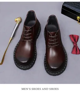 Detail view of dark brown gradient leather derby shoes with professional business accessories