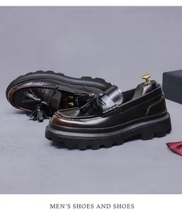 Detail view of dark brown leather tassel loafers with a chunky sole and wooden shoe trees