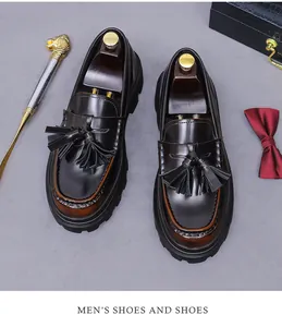Macro shot of dark brown leather tassel loafers with retro polished finish and thick soles
