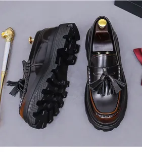 Close-up of leather tassel loafers with thick lug soles and vintage hand-brushed finish