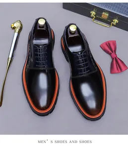 Close-up of leather derby shoes with gradient finish and bold orange contrast thick sole