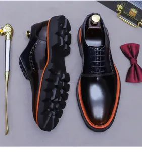 Macro detail of gradient leather shoe with vibrant orange welt and jagged rubber sole