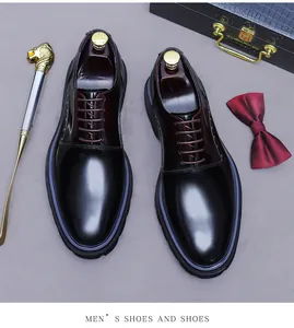 Top view of premium leather ombre dress shoes with luxury accessories and velvet bow