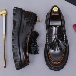Vintage dark brown leather tassel loafers with thick lug sole and polished finish