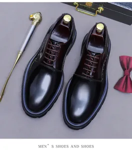 Top view of gradient leather derby shoes with wood shoe trees and elegant bow tie decor