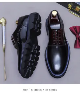 Macro shot of burgundy polished leather shoes with thick lug soles and dapper accessories