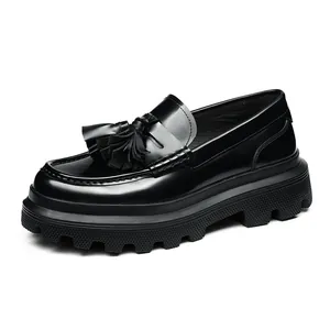 Polished leather platform loafers with tassel detail and chunky lug sole in classic black