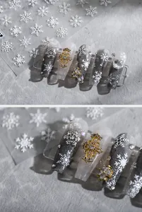 Detail van 5D witte sneeuwvlok nagelstickers met goud en zilver reliëf winter ornamenten