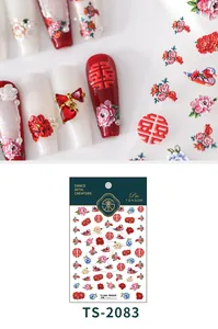 Macro detail of 3D embossed nail stickers with Chinese wedding peony and mandarin duck motifs