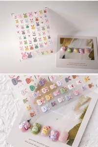 Detail view of 3D embossed cartoon rabbit nail art stickers with colorful pastel resin texture