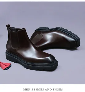 Close-up of dark brown leather Chelsea boot with elastic side panel and thick rubber sole