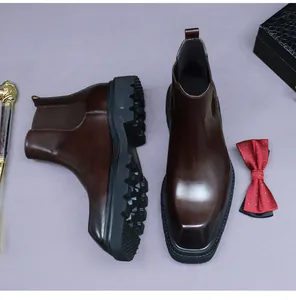 Close-up of dark brown leather Chelsea boots with square toe and thick lug soles
