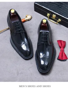 Zapatos Oxford Brogue negros clásicos con detalles de punta de ala y textura elegante