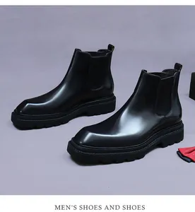 Detailed close-up of premium black leather Chelsea boot with elastic side and thick sole