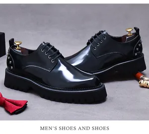 Detail of black leather derby shoe featuring metal rivet accents and glossy finish