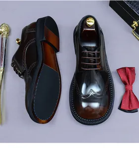 Detailansicht brauner Brogue-Business-Schuhe mit Flügelkappe und rutschfester Sohle