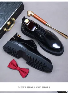 Glossy black leather derby shoes with silver studs, thick lug sole and wooden trees
