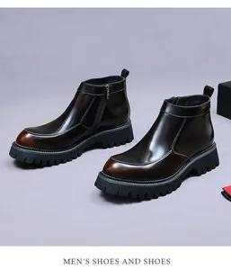 Detail of premium brown leather Chelsea boots with side zipper and rugged lug sole