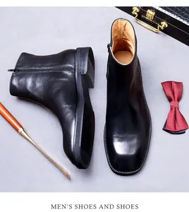 Dettaglio degli stivaletti Chelsea in pelle nera di qualità con zip e suola antiscivolo