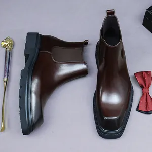 Classic dark brown leather Chelsea boots with thick rubber soles and elastic side panels