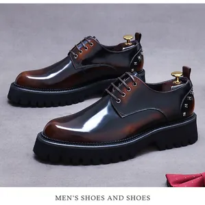 Macro view of men's leather derby shoes with silver studs and thick lug soles