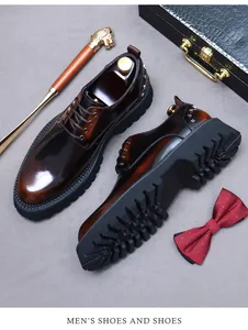 Brown leather derby shoes with thick lug soles and metal rivet details on the heel