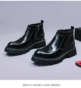 Detail of men's glossy leather Chelsea boots with lug sole and side zipper