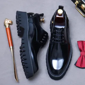 Men's polished leather derby shoes with thick soles and stud details from a top view