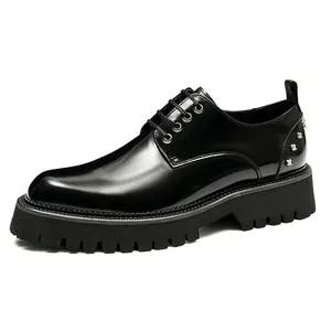 Men's glossy black leather dress shoes with thick lug soles and silver cross studs