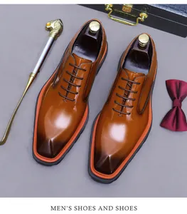 Zapatos oxford de cuero marrón degradado con vira naranja y accesorios para caballeros