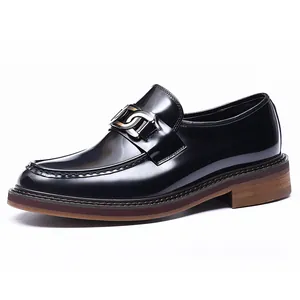 Polished black leather loafers for men featuring a metallic buckle and thick platform sole