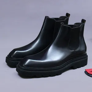 Classic black leather Chelsea boots for men featuring a square toe and thick lug sole