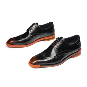 Men's polished brown leather Brogue shoes with carved patterns and orange sole