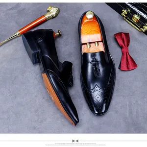 Top-down shot of men's leather brogues with tassel detail and handmade craftsmanship