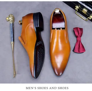 Formal brown leather loafers set with briefcase and tie in a luxury British style
