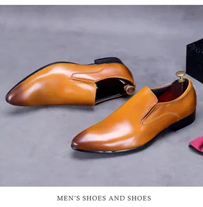 Detail view of brown gradient leather dress shoes with premium shoe tree on grey background