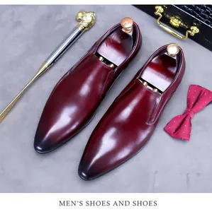 Detail of burgundy leather oxford shoes with gradient toe and luxury accessories