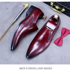 Detailed macro view of gradient burgundy leather on formal men's pointed-toe business shoes