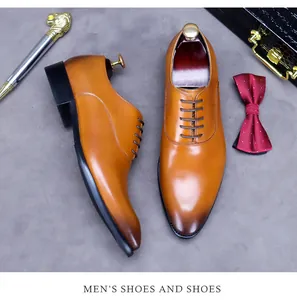 Detailansicht der Premium-Lederschuhe in Braun mit Farbverlauf und eleganten Business-Accessoires