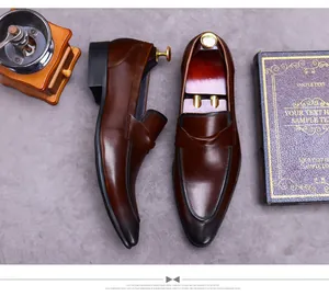 Macro shot of dark brown leather loafers with burnished toe and strap detailing