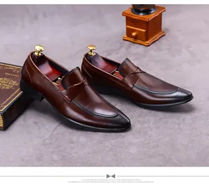 Detail of dark brown leather loafer with hand-finished black gradient toe and glossy finish