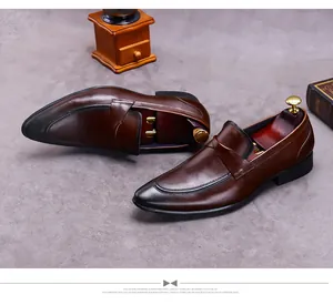 Detail of dark brown leather loafers with vintage toe burnishing and shoe tree insert