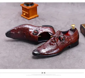 Macro detail of dark brown monk strap leather shoes with crocodile texture and buckle