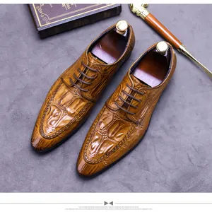 Detailed top view of brown embossed leather derby shoes with elegant wooden shoe trees
