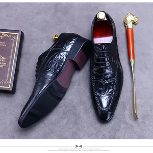 Detail of black embossed leather oxfords with anti-slip sole and wooden shoe tree