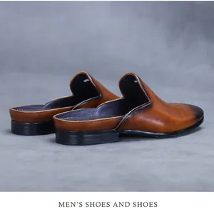 Detailed side view of men's leather mule in burnished brown with Scritto laser engraving